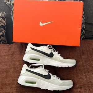 *New. Never Used. White with black and green insoles Nike Shoes size 5.5Y